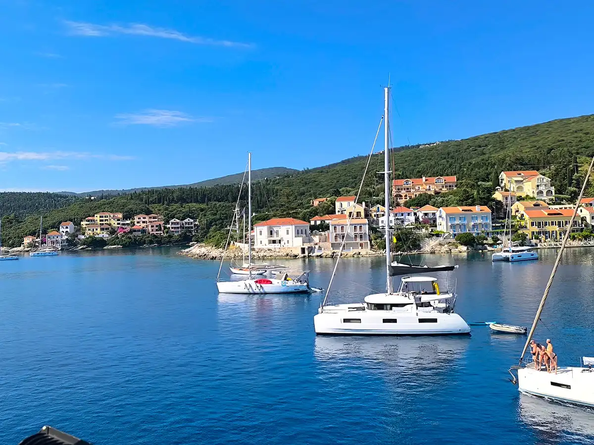 Sailboats anchored in a harbor village on Kefalonia