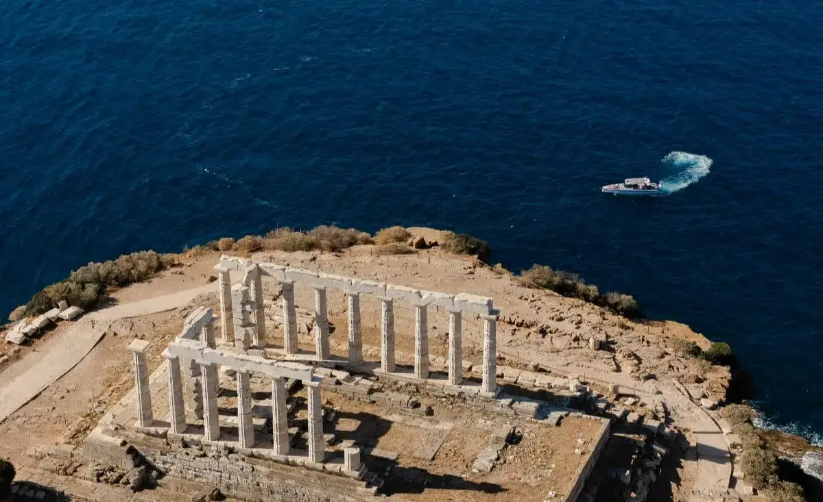 Aerial view of the Temple of Poseidon at Cape Sounion, Athens, with the Aegean Sea in the background