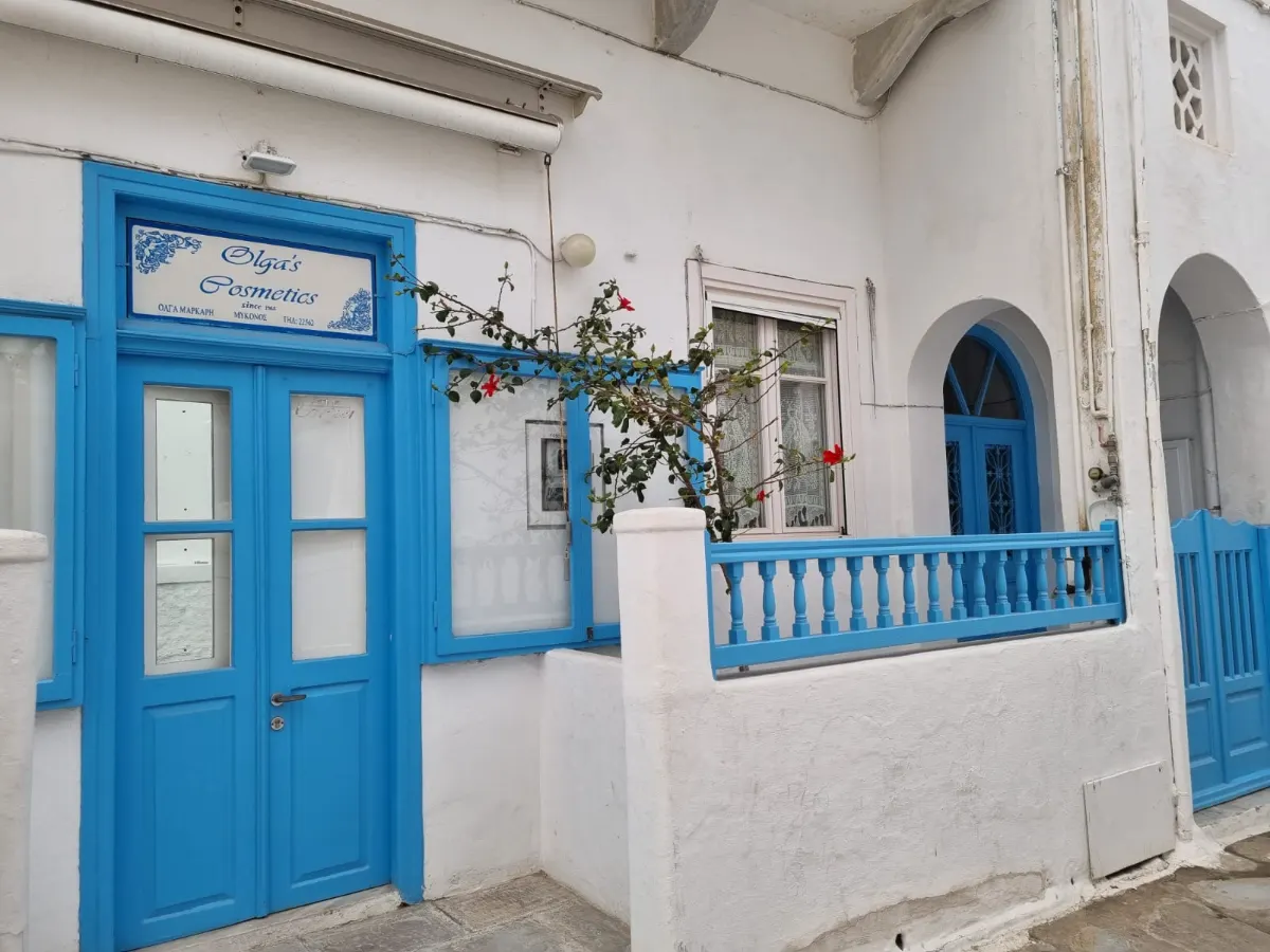 Traditional whitewashed Cycladic architecture with blue door in Mykonos Town