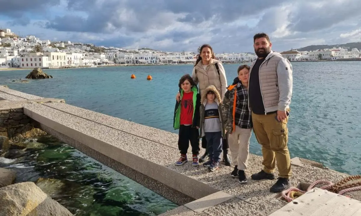 Family with children arriving at Mykonos port from cruise ship